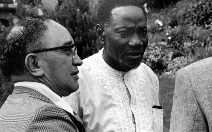 Alhaji Yakubu Tali, the Tolon Na, in an embroidered tunic, photographed beside a European official
